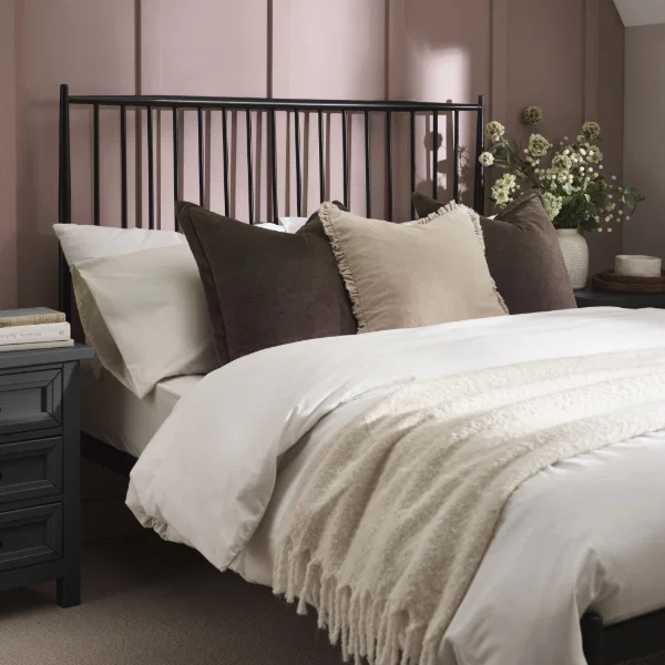Lifestyle shot of floyd spindle headboard in black metal